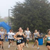 Competitive participants running after starting the event